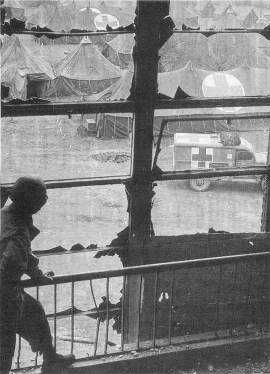 Dodge WC54 ambulance passing through US Army's 48th General Hospital, Germany, 1945