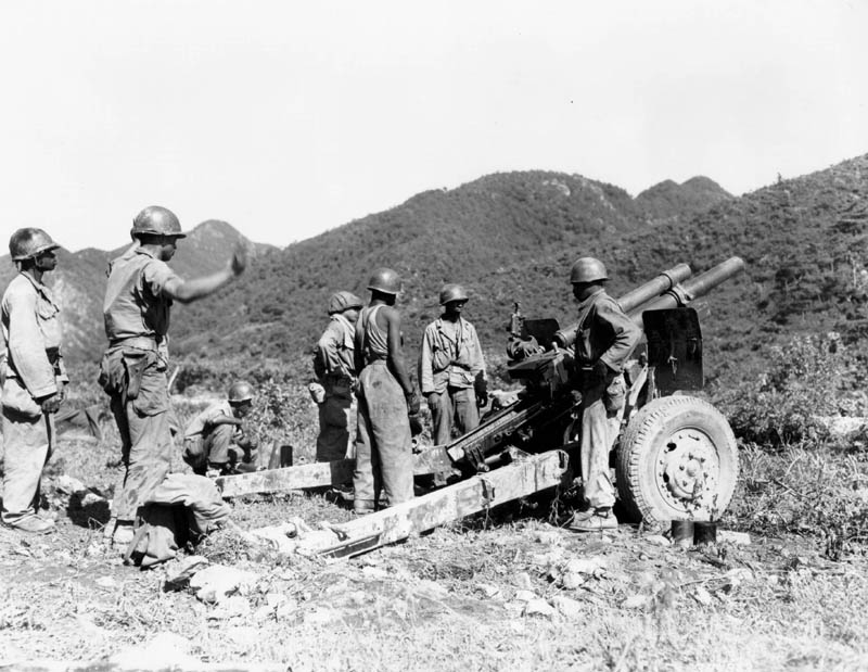 African-American US Army 105mm Howitzer M2A1 crew in Korea, 25 Jul 1950