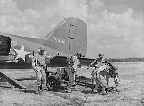 Unloading a 37 mm Gun M3 from a transport aircraft, Fort Bragg, North Carolina, United States, Sep 1942