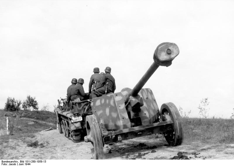 German 7.5 cm PaK 40 anti-tank gun being towed by SdKfz. 10 half-track vehicle, Vitebsk, Russia, Jun 1944