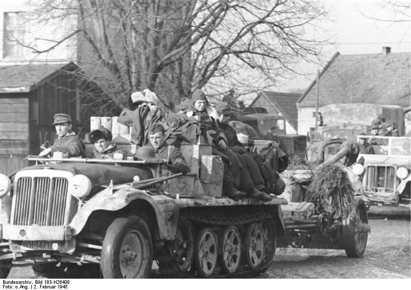 German troops on retreat in the Upper Silesia region, Germany (now Poland), 2 Feb 1945; note SdKfz. 10 half-track vehicles towing 7.5 cm PaK 40 guns