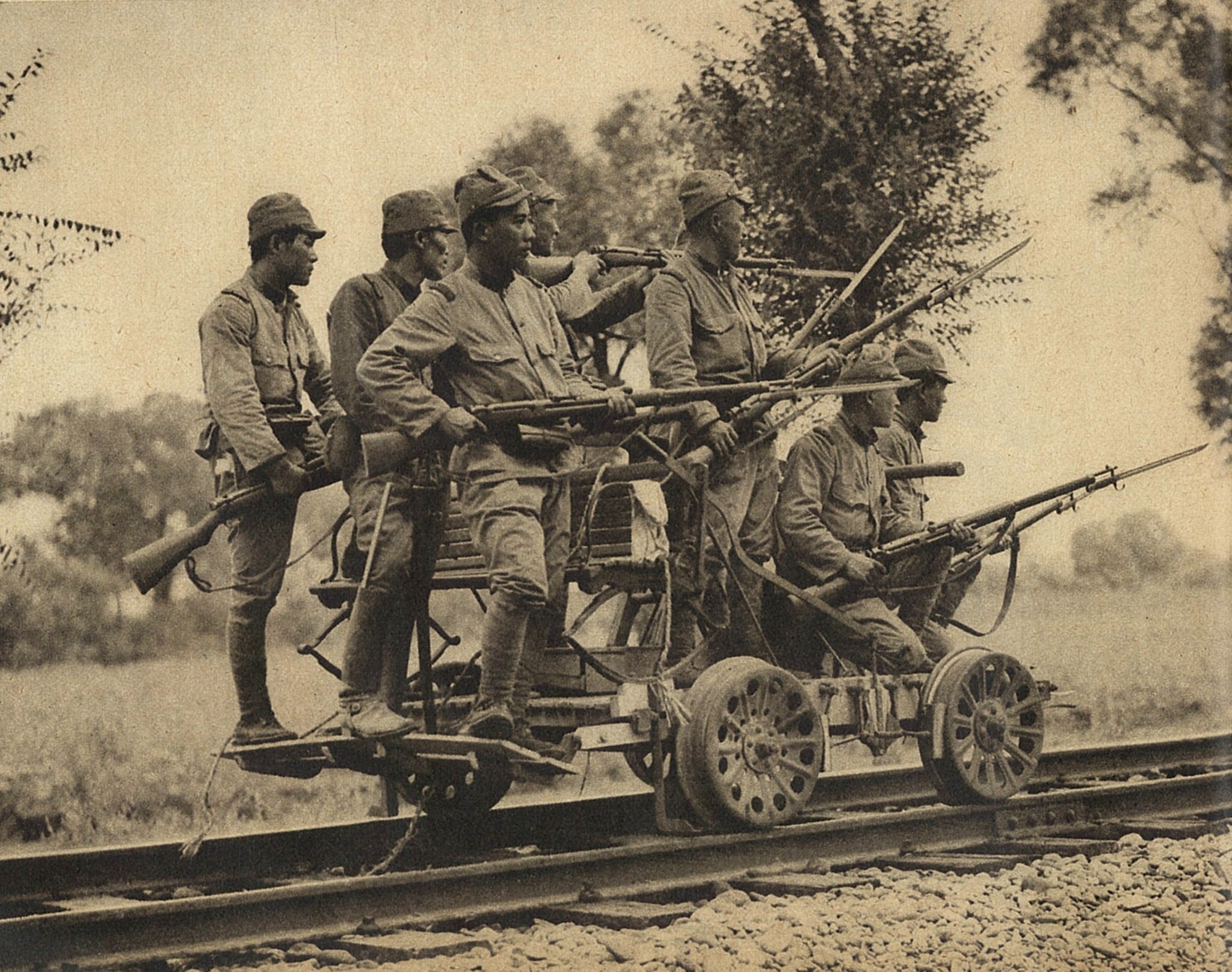 Japanese Army soldiers with Arisaka Type 38 rifles on a hand cart, China, 1937; seen in the 1 Sep 1937 issue of the Japanese publication Asahigraph