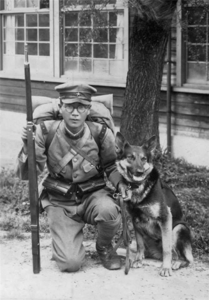 Japanese Army Private 1st Class with dog and Arisaka Type 38 rifle, date unknown