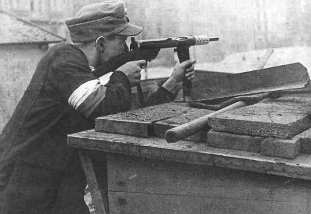 Polish resistance fighter with Blyskawica submachine gun during the Warsaw Uprising, Powisle district, Warsaw, Poland, Aug 1944