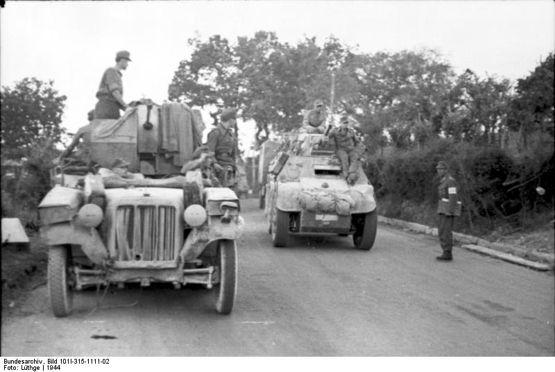 German troops with SdKfz. 10 and AB 41 vehicles, Rimini, Italy, 1944