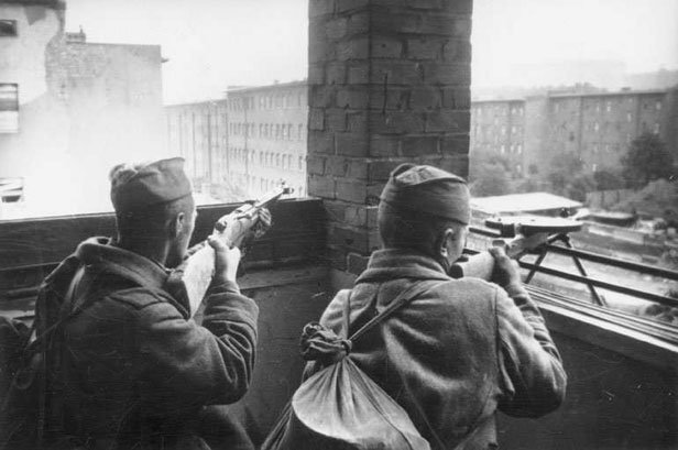 Russian troops fighting in Berlin, Germany, circa Apr-May 1945; note Mosin-Nagant M1944 Carbine and Degtyaryov Pekhotny 'DP' light machine gun