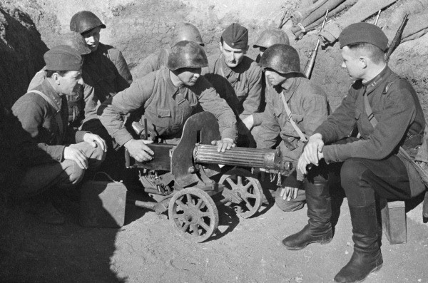 Soviet brigade commissar Veselov with a machine gun crew, Russia, Apr-May 1942; note Maxim M1910 machine gun