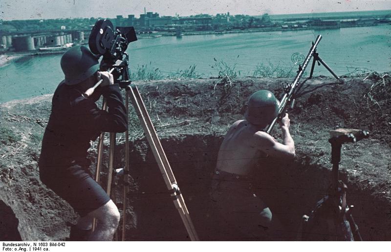 A German soldier aiming with a MG 13 machine gun while filmmaker Horst Grund operated his camera, Constanta, Romania, circa 1941, photo 1 of 2