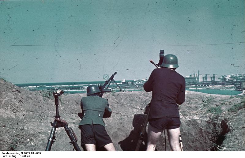 A German soldier aiming with a MG 13 machine gun while filmmaker Horst Grund operated his camera, Constanta, Romania, circa 1941, photo 2 of 2