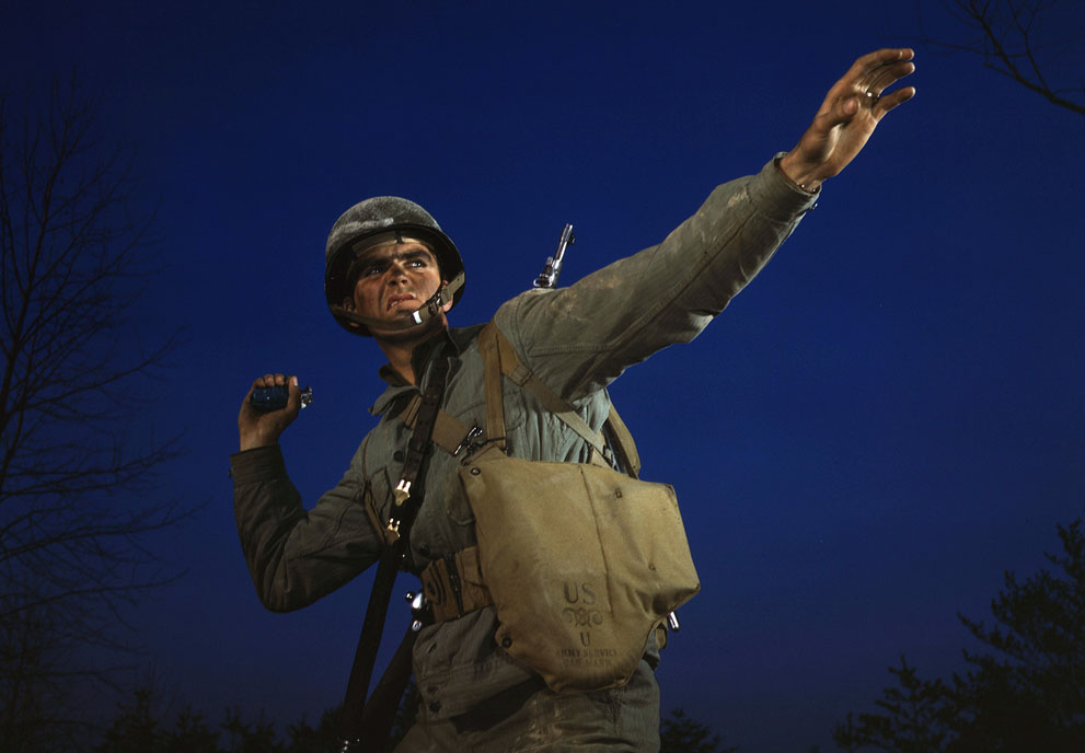 An American soldier posing with a grenade, Fort Belvoir, Virginia, United States, date unknown