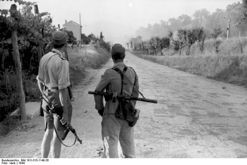 German soldiers guarding an Italian road, 1944; note German MP 40 and Soviet PPSh-41 submachine guns