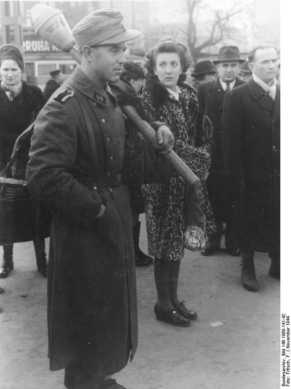 Hungarian civilians and a German SS soldier in Budapest, Hungary, Nov 1944; note Panzerfaust