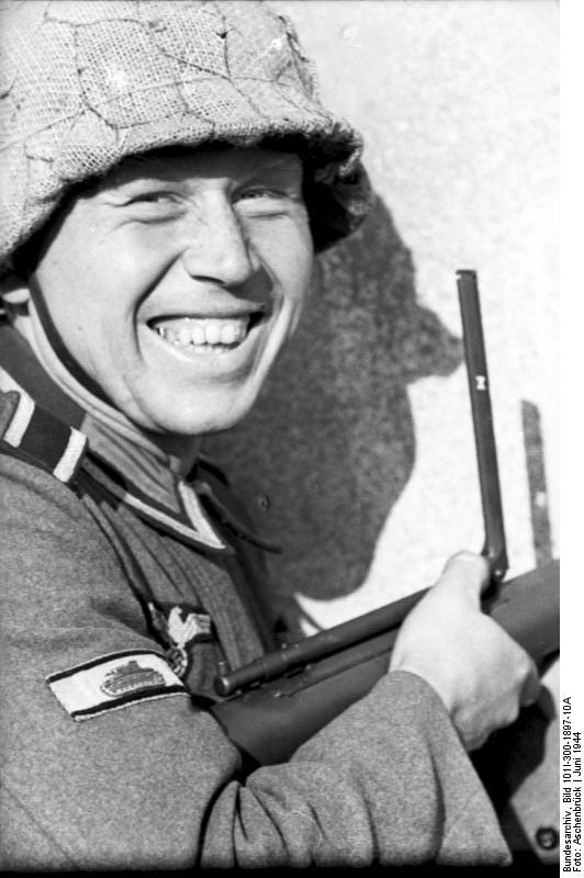 German sergeant posing with Panzerfaust weapon, Jun-Jul 1944; note tank destruction badge on the sleeve