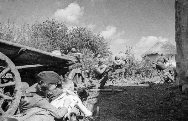 Soviet troops with PPSh-41 submachine guns in a village in the Caucasus region of southern Russia, summer 1942