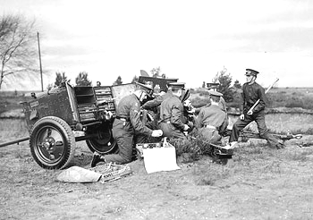 Crew of a 3.7-inch howitzer of A Battery (The Chestnut Troop) Royal Horse Artillery prepared their gun for firing during an exercise, England, United Kingdom, circa 1938