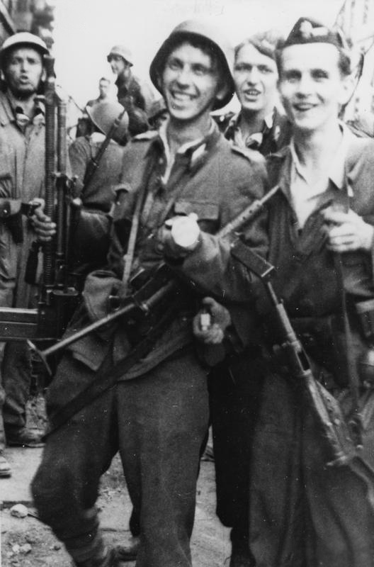 Polish resistance fighters Edward Mortko, Bernard Zieliński, Zbigniew Maliński, and Kazimierz Zagórski of 'Kiliński' battalion near the PAST building on Zielona Street in Warsaw, Poland, 20 Aug 1944