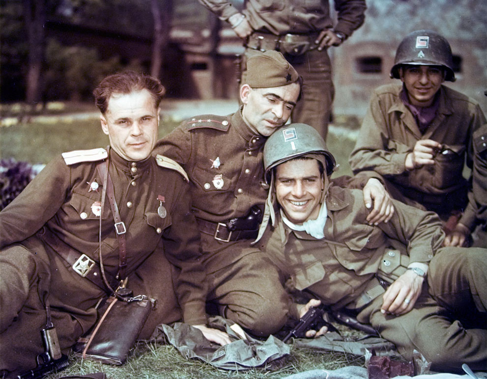 Soviet and US officers near Elbe River, Germany, 28 Apr 1945; note left Soviet officer's TT-33, center Soviet capt's Luger in belt, right US lieutenant's holstered Colt 1911 and in-hand Walther P38
