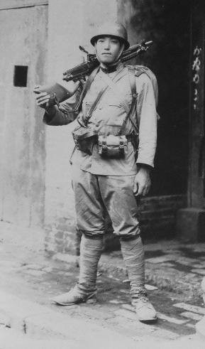 Japanese Army soldier with a Type 11 machine gun, circa 1940s